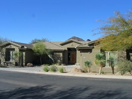 Front of home with beautiful landscaping
