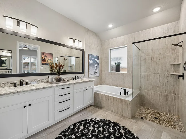 XL tub with upgraded shower. Lots of tile and stone