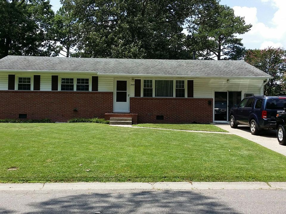 Front view of property with spacious front yard and off stre
