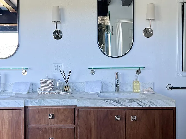 Custom walnut vanity with plenty of storage.