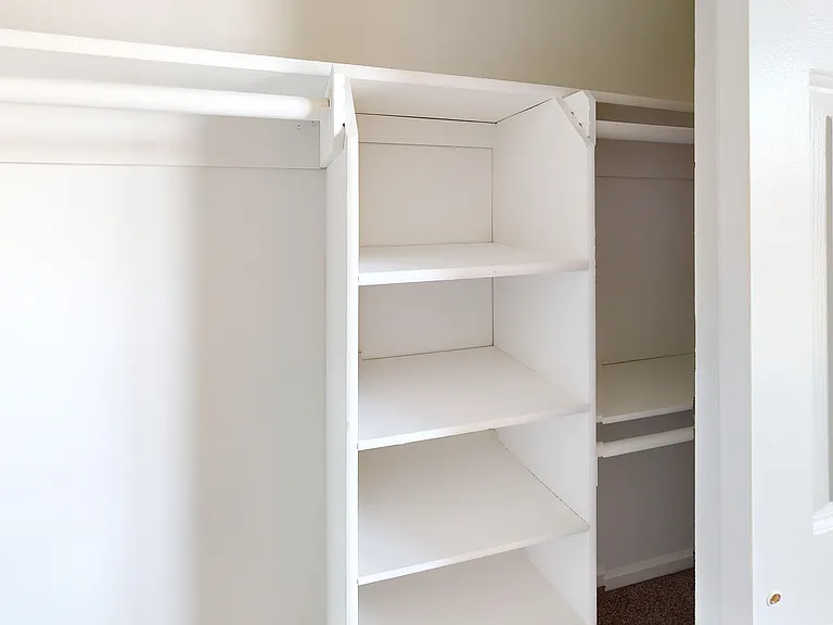 Thoughtful touches like custom wood shelving add both charm and function throughout your home.