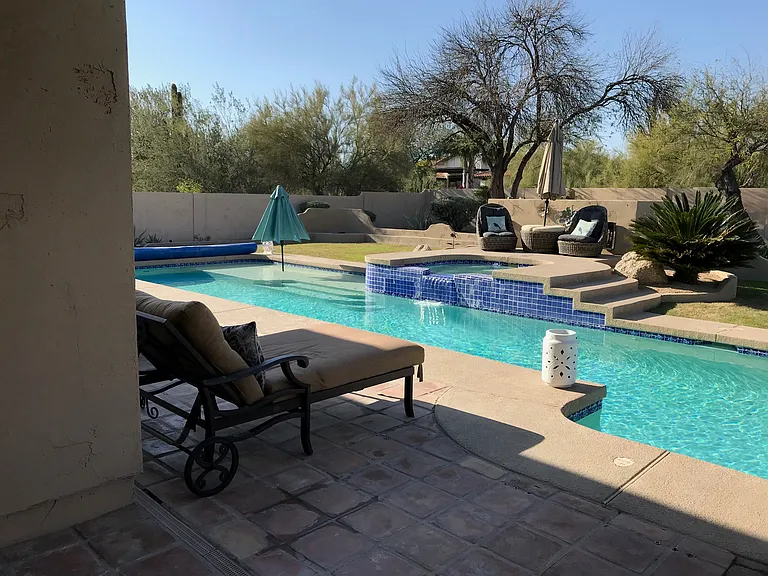 heated 60' lap pool, spa and backyard
