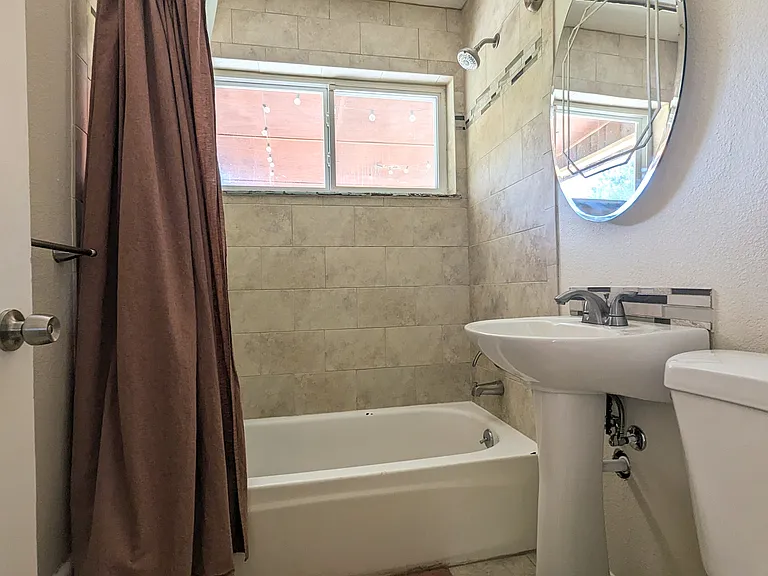 Upstairs bathroom with tub