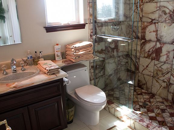 Corner bedroom bathroom and shower for rent.