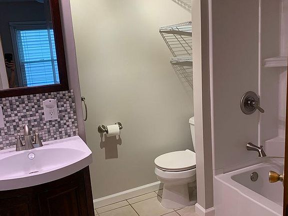 Bathroom with new tub/shower.