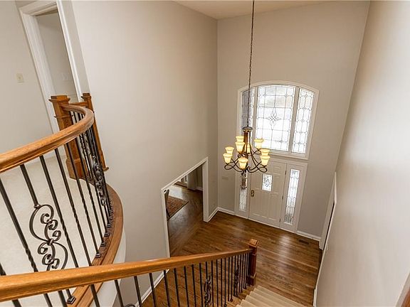 Grand 2 Story Entry...w sweeping wrought iron stairway....recently painted so fresh and clean