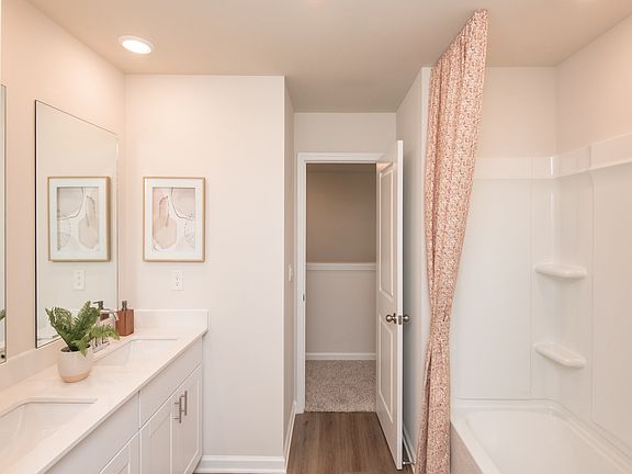 Dual sinks in the secondary bathroom make mornings a breeze.