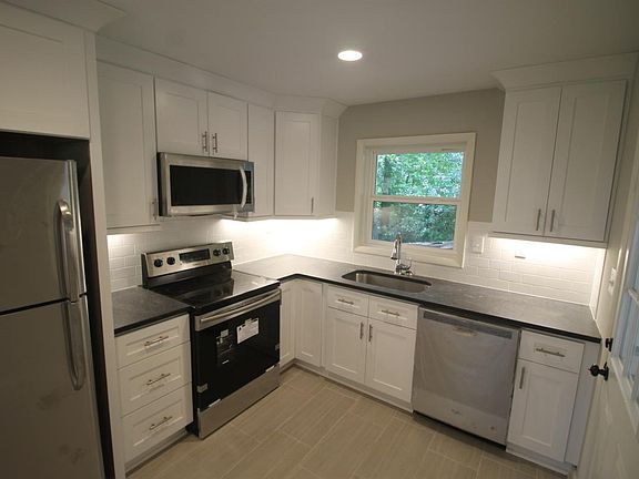 Kitchen with granite and new SS appliances