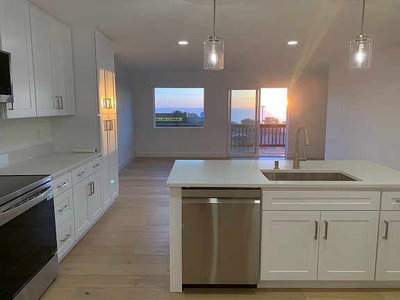 Enjoy beautiful sunsets from the kitchen and living room.