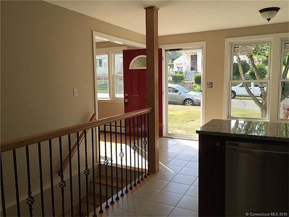 Tiled front entrance that e...