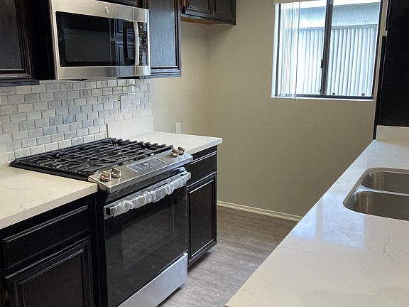 Remodeled kitchen with Quartz countertops and new stainless steel appliances