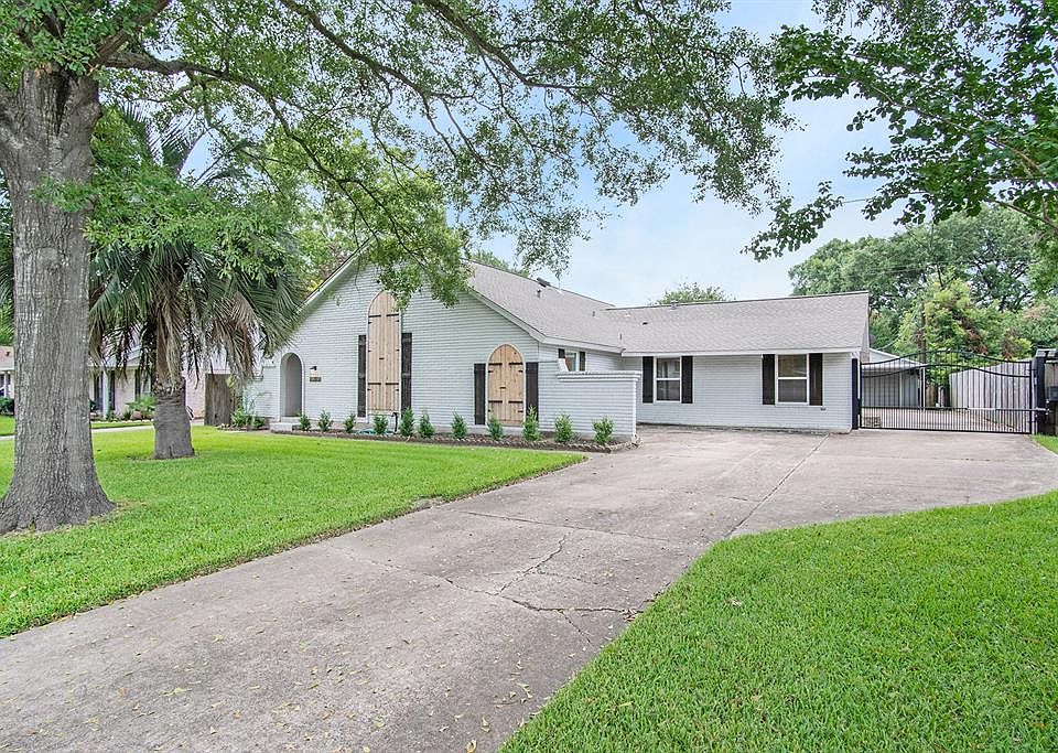 Beautiful renovated one story brick home on large lot offering to master bedrooms.