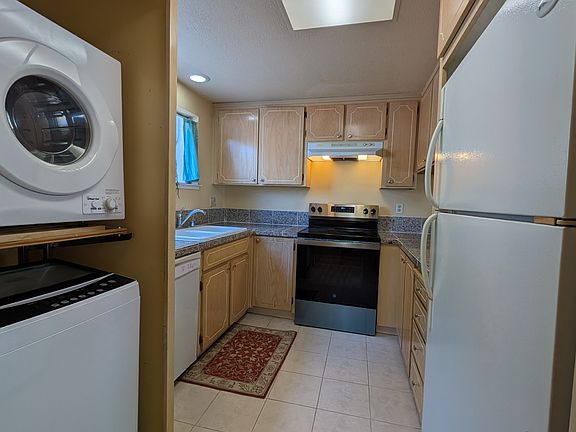 Inside laundry with washer and dryer.