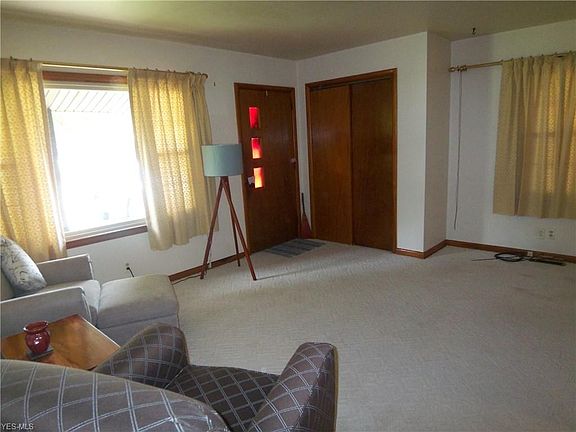 Livingroom front door and a double closet for coats.  Small alcove for furniture on the right.