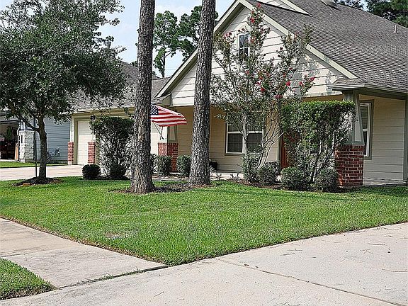 Front has nice trees and welcoming front porch.