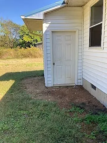 Exterior Storage Room - it is small but perfect for storage bins, yard tools, etc.