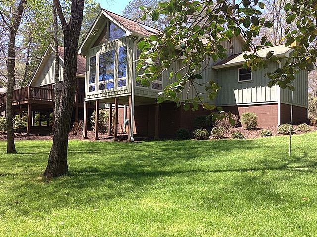Backyard centered on sunroom