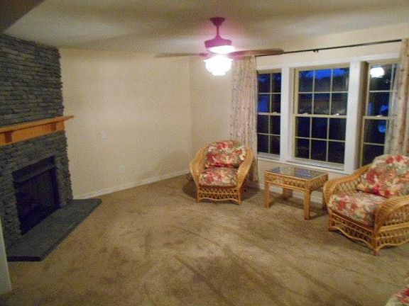 living room w/stone gas fireplace