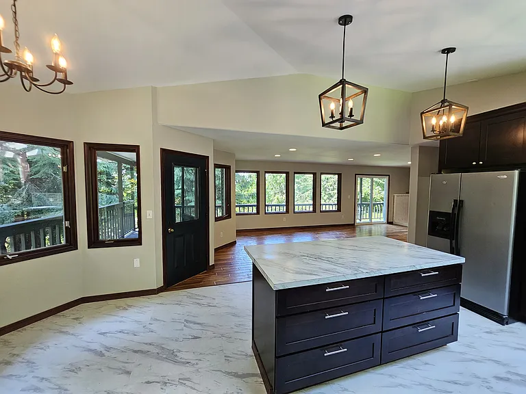 TONS of storage, large center island with soft close drawers and access to wrap-around deck.