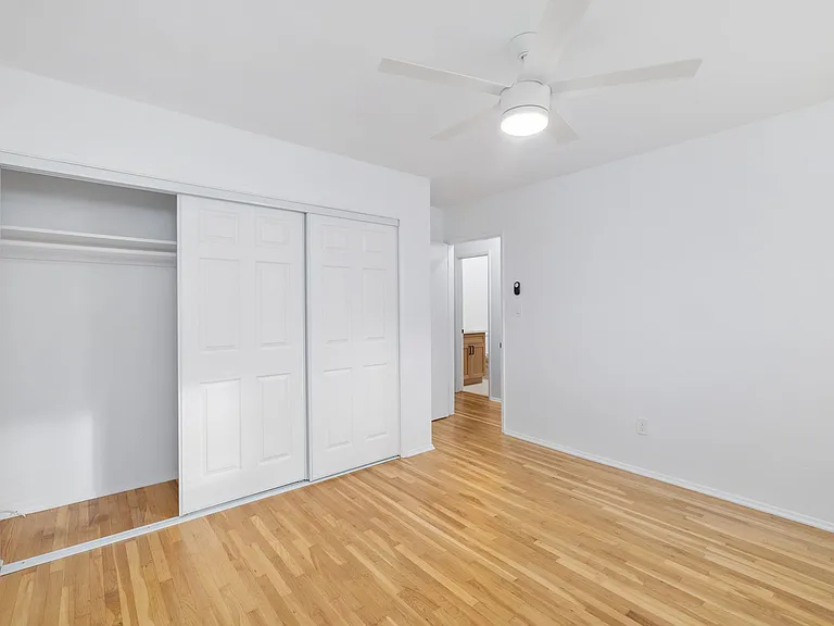 A larger bedroom layout features an equally impressive closet, providing exceptional storage for your clothes and daily essentials.