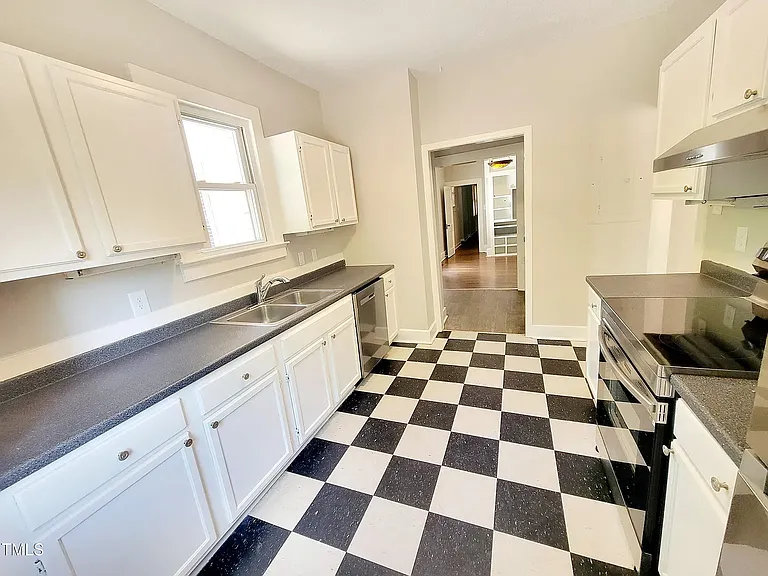 Kitchen all stainless appliances including a dishwasher