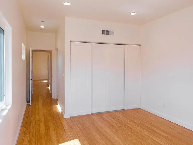 Front Bedroom Closet & Hallway Leading to Rear Bedroom