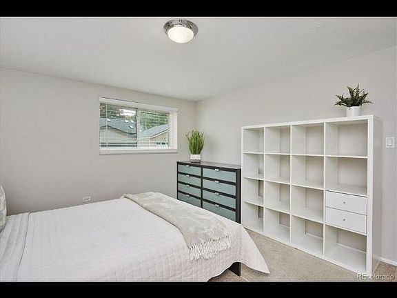 Retreat to the carpeted master bedroom filled with ample windows, two huge side by side sliding door wall closets, and wall shelves as shown above. This window overlooks the dedicated parking space for your unit. Looking out the triple pain window, you w