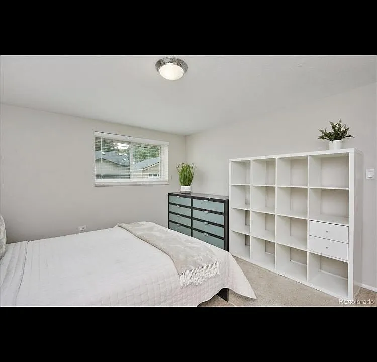 Retreat to the carpeted master bedroom filled with ample windows, two huge side by side sliding door wall closets, and wall shelves as shown above. This window overlooks the dedicated parking space for your unit. Looking out the triple pain window, you w