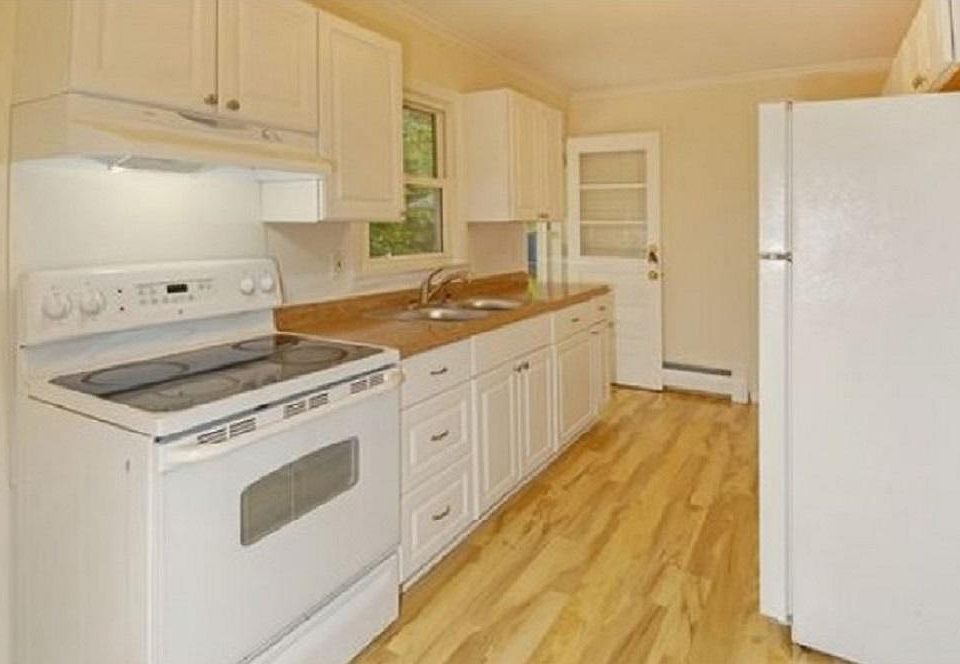 Generous well maintained kitchen with plenty of cabinets for storage