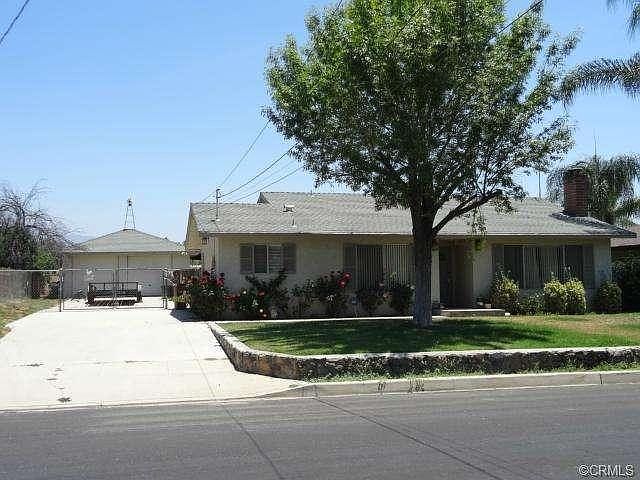 12753 13TH ST. VIEW OF GATED, PAVED, RV PARKING AND 2 CAR GARAG