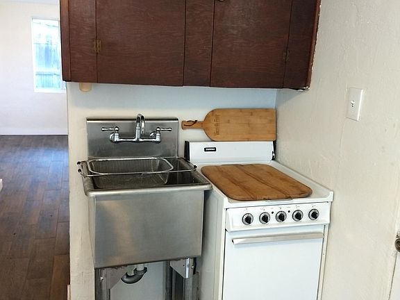Kitchen area. We can add counter or rolling island.