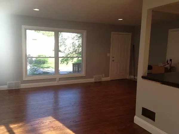 Large, new windows, with new hardwood flooring