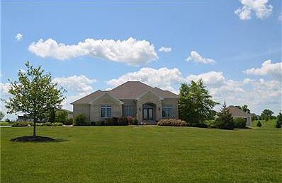 EXTERIOR FRONT.  Quality Custom Built home with 4 Bedrooms, 2 Full Baths, 2 Half Baths, a spacious 4740 sq. ft. and on a private 10 acres.