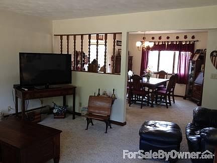 Living room looking into dining room : Upstairs living room off of the front door looking into the f
