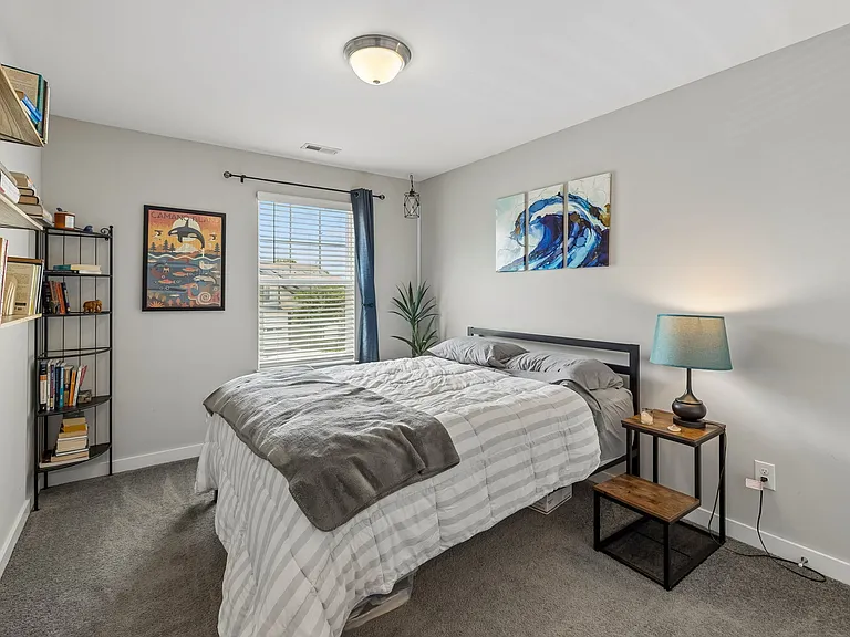 Spacious bedroom with large closet and natural light.