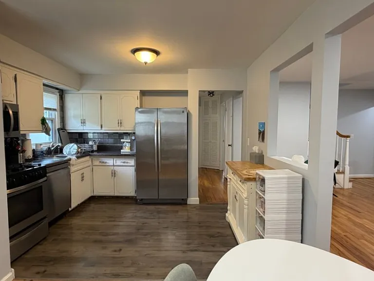 Cabinets and plenty of room for prep island or bar & stools