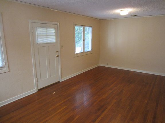 Living room with restored hardwood floors.