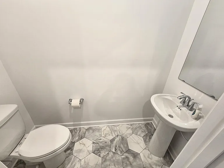 Lower floor guest/half bath.