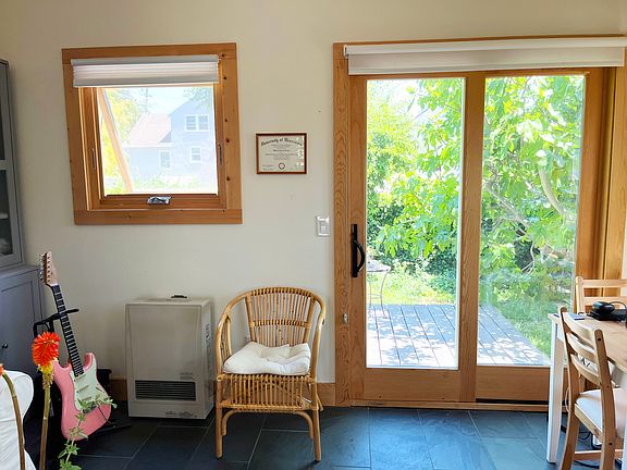 Sliding doors open to your own private deck surrounded by greenery.