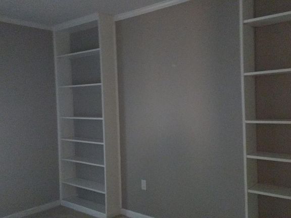 Built in shelving in second bedroom.