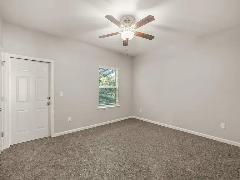 Downstairs bedroom w/ private bath, backyard access, and walk-in closet