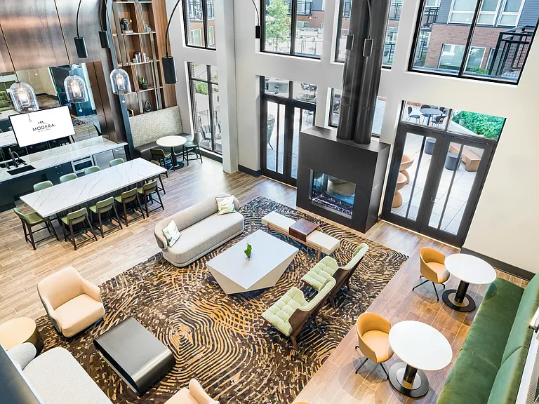 Overhead view of the clubroom with bright open windows overlooking the interior courtyard.