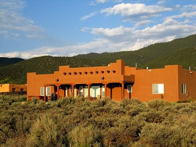 Nestled in southwest sage and backed by Sangre de Christo Mo