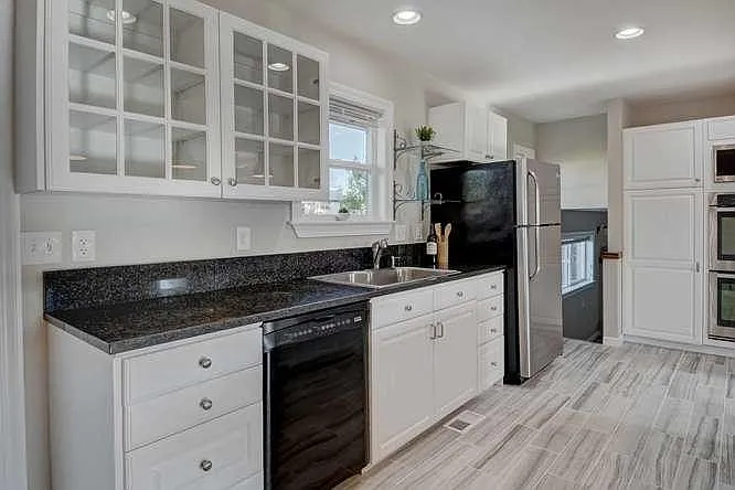 Large refrigerator, dishwasher, garbage disposal, open view