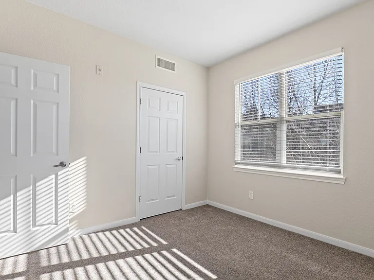 Plush bedroom carpeting at Switchback on Platte Apartments in Littleton, CO