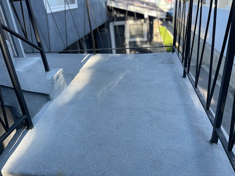 Stairway landing in front of unit #2