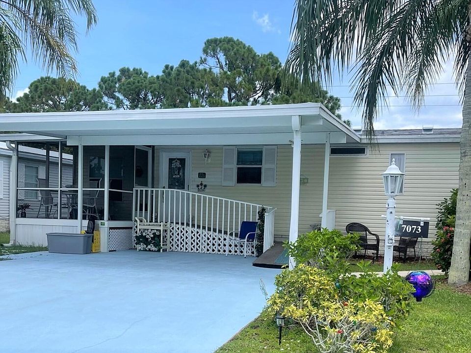 Front of Home with large Carport to cover vehicles
