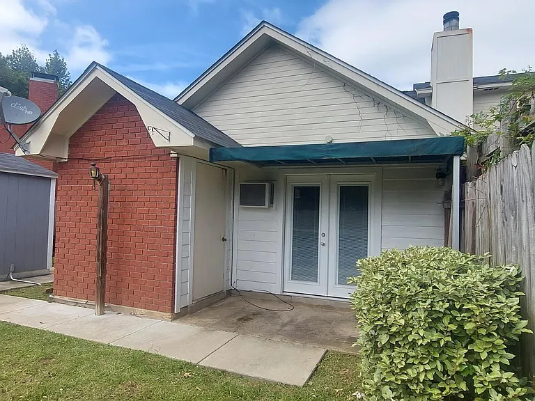 Exterior storage/ utility room. Canopy over back.
