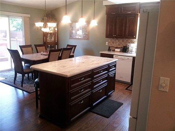 Remodeled and updated kitchen opens into the dining room and fea