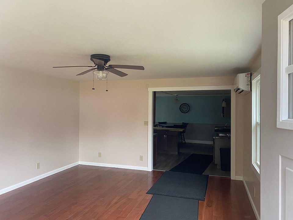 Main, entrance from lake side of house. Living room. 17'6" X 14'